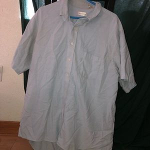 A men’s blue button up tee shirt